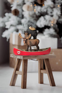 Stacked Winter Animals in Canoe